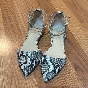 Seychelles Plateau python leather ankle strap flats in black and white.